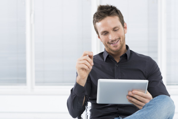 Young Man Using Digital Tablet